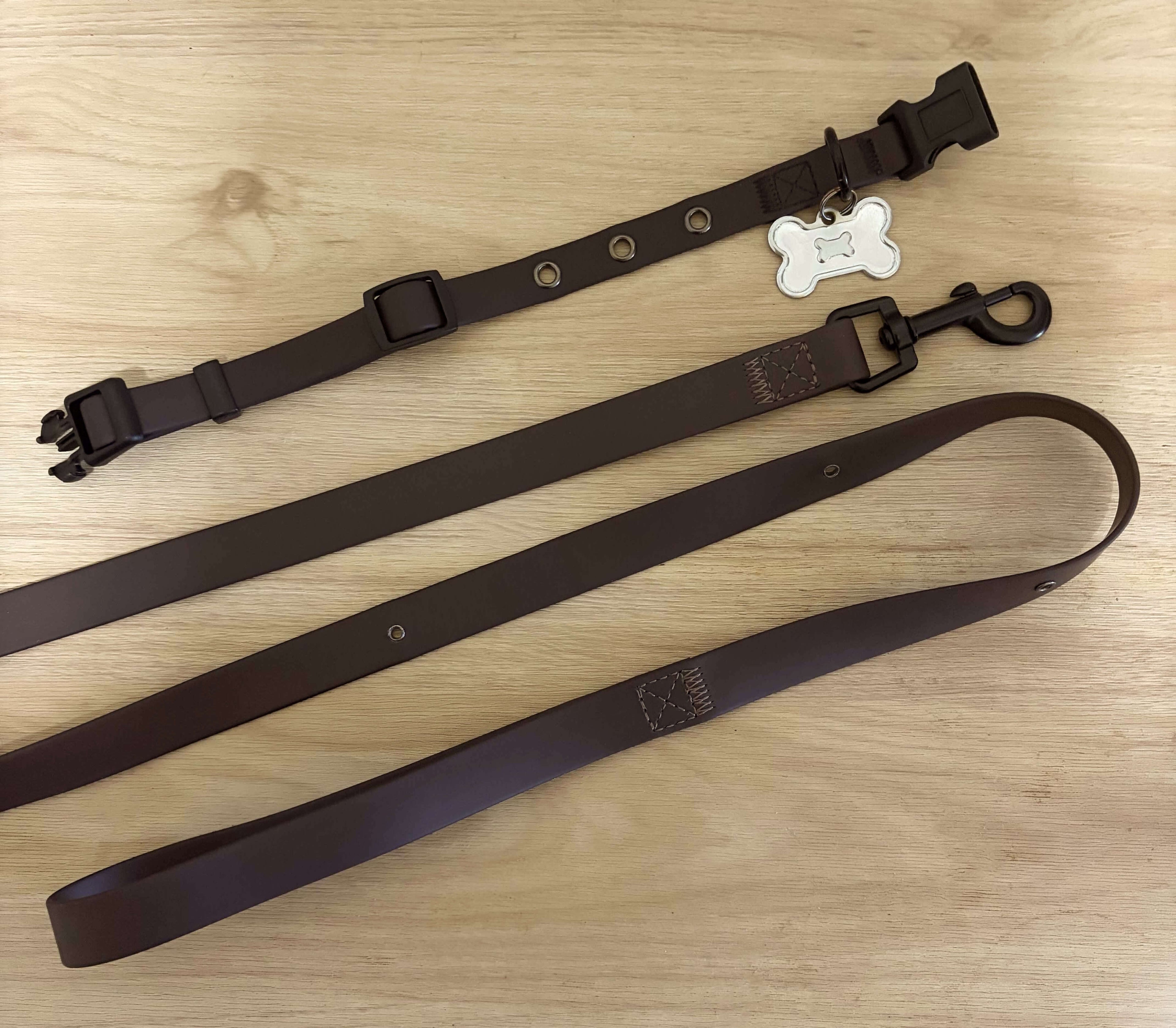 Brown waterproof dog leash and matching collar set with black hardware, handcrafted from vegan leather by Pooches & Cream.