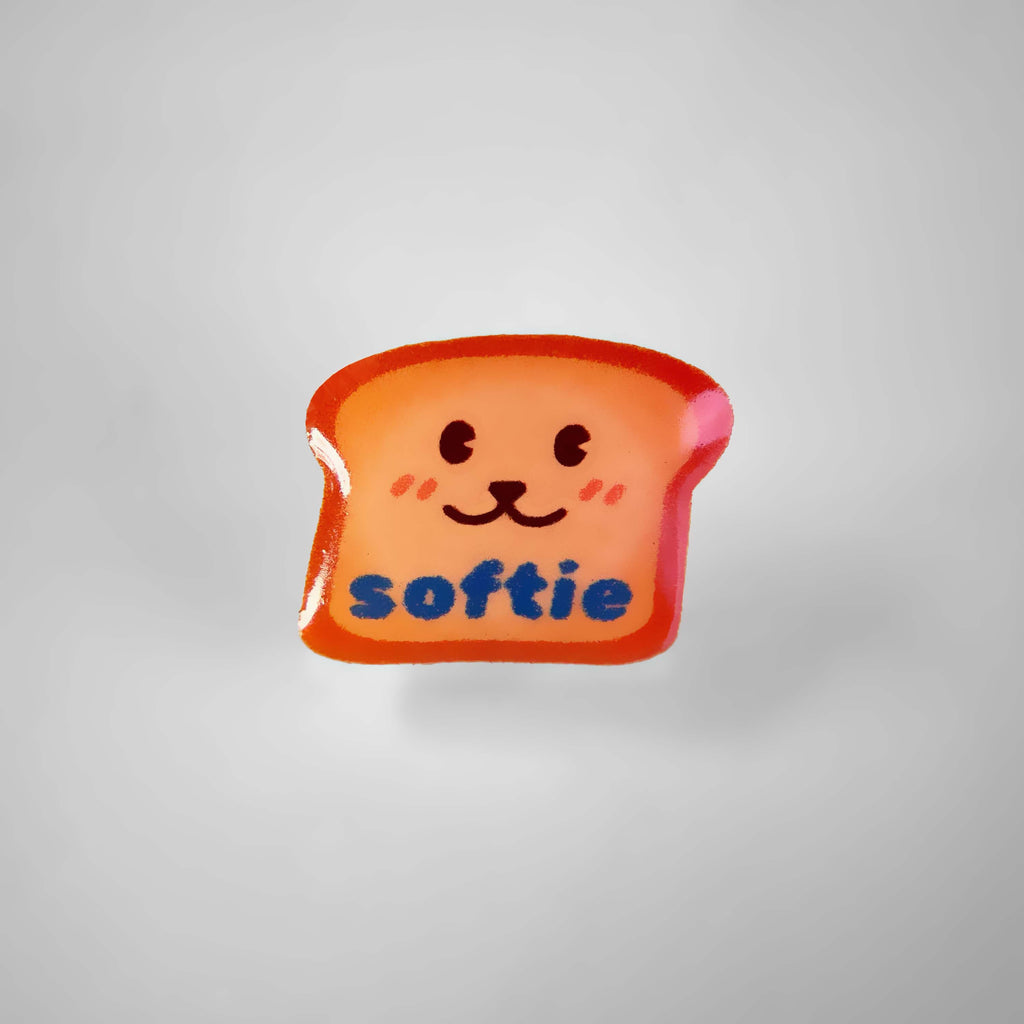 Dog charm shaped like a piece of bread with the word 'Softie'