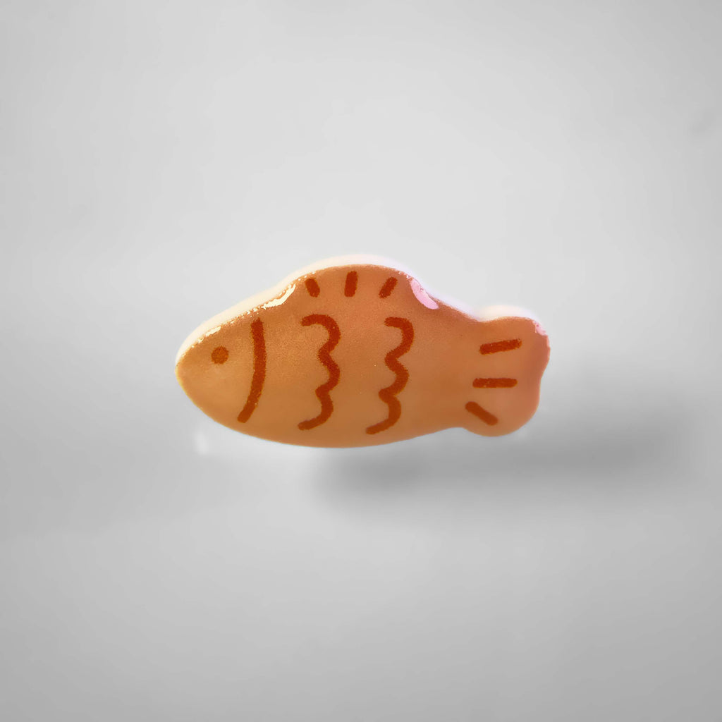 Dog collar charm of a japanese fish shaped pancake.