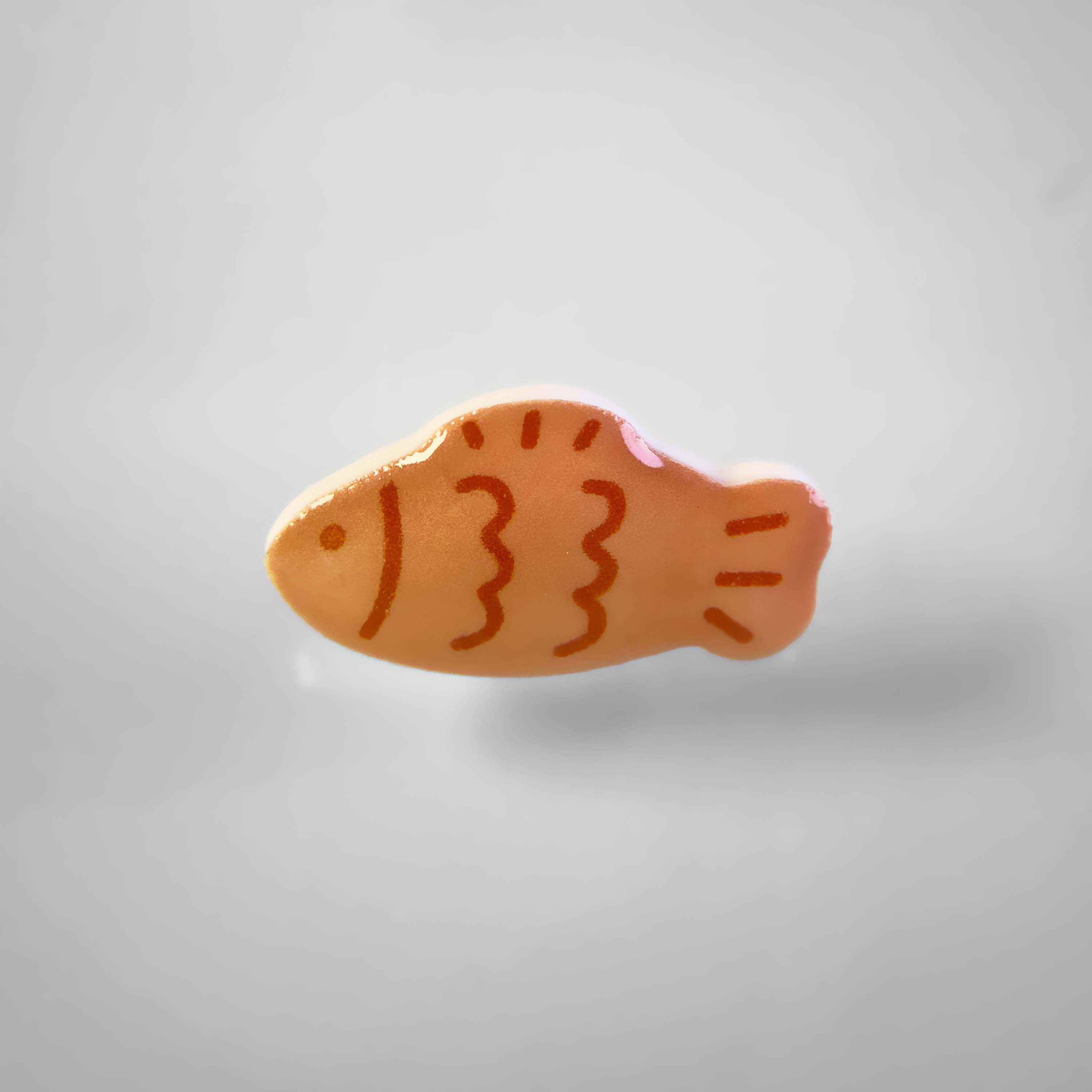 Dog collar charm of a japanese fish shaped pancake.